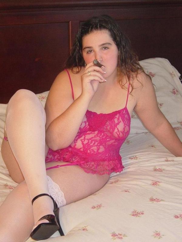 20P Chubby babe casually smoking large cigar on bed