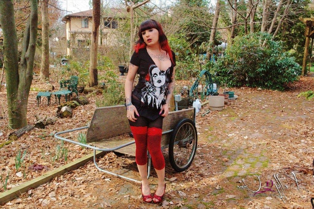 12P TS Kelly Clare stripping in the garden