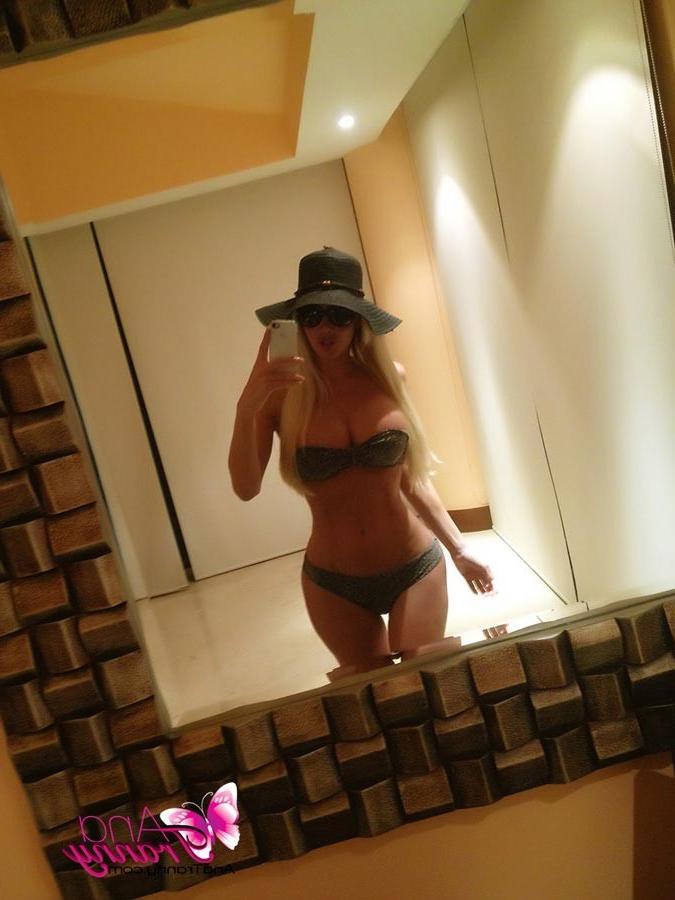 12P Playful Tranny Ana Mancini Taking Self Shot Pics With Her New Phone