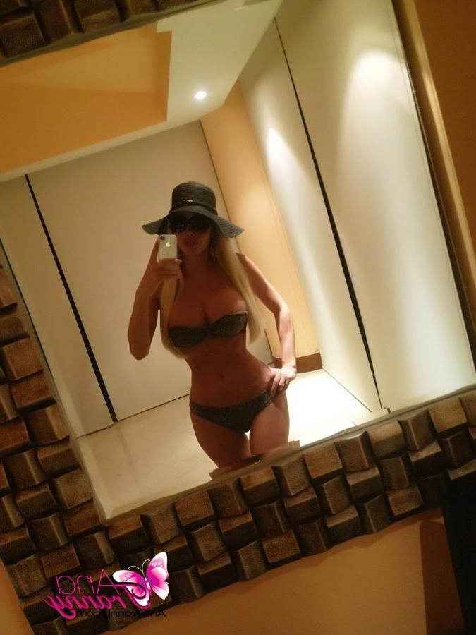 12P Playful Tranny Ana Mancini Taking Self Shot Pics With Her New Phone