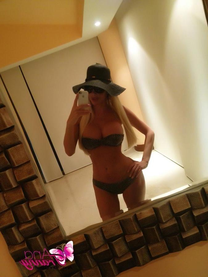 12P Playful Tranny Ana Mancini Taking Self Shot Pics With Her New Phone