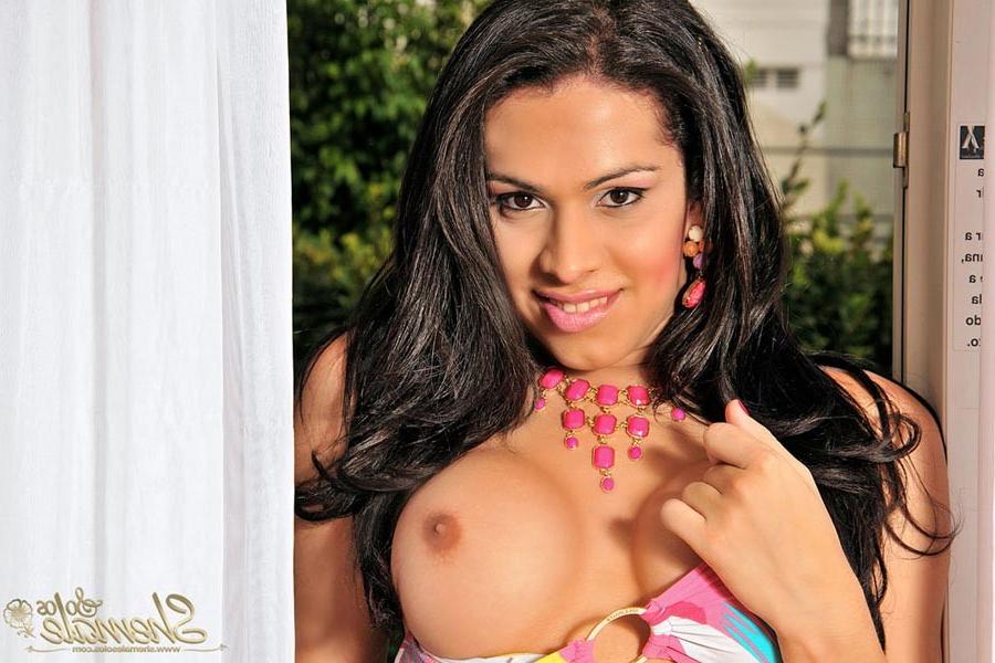 15P Sexy brunette tgirl shows off her massive cock