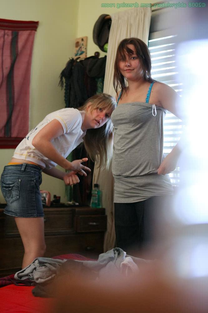 16P Two cute nudes caught getting dressed in tight panties and bras