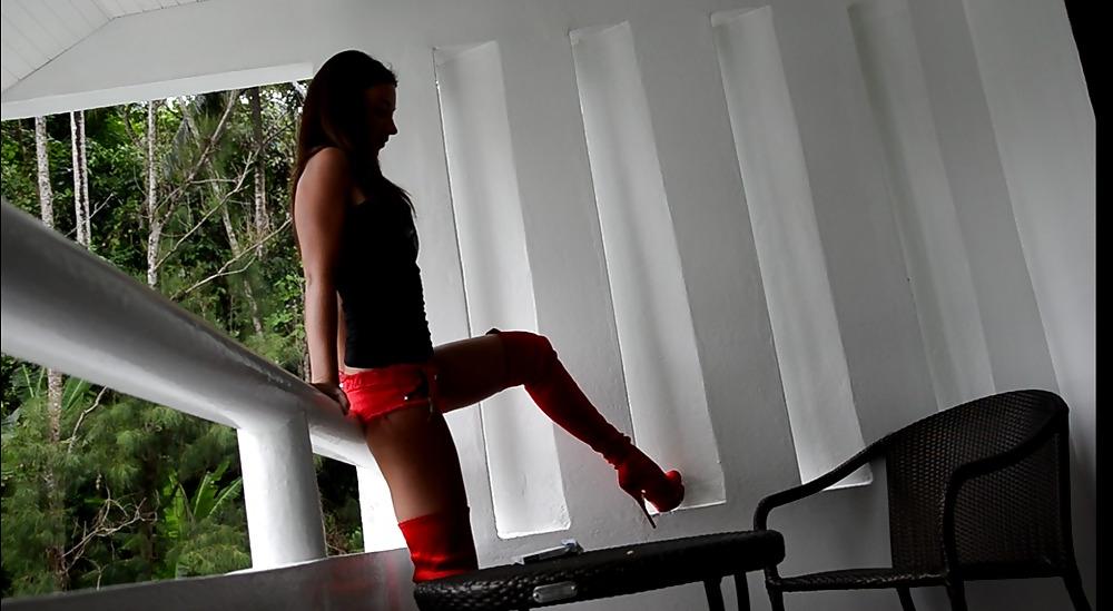 6P Young slut in micro short & red designer boots