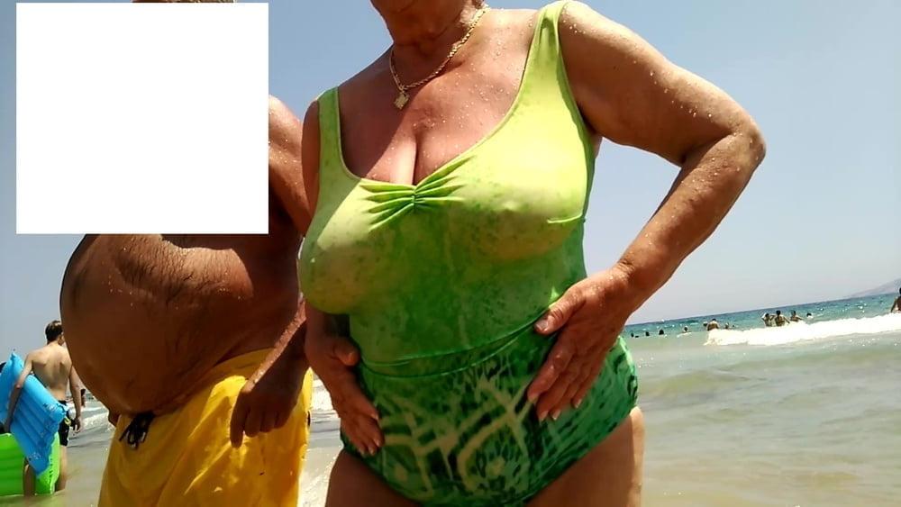 25P Granny big boobs beach 2