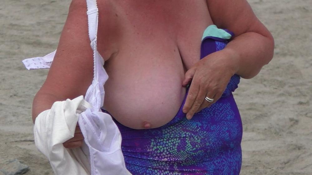25P Granny big boobs beach 2