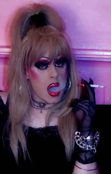 25P Smoking  glam transvestite with heavy make up