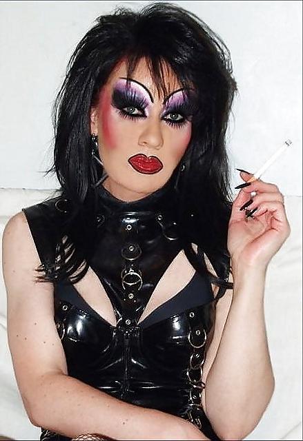 25P Smoking  glam transvestite with heavy make up