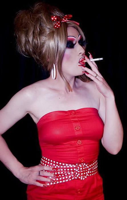 25P Smoking  glam transvestite with heavy make up