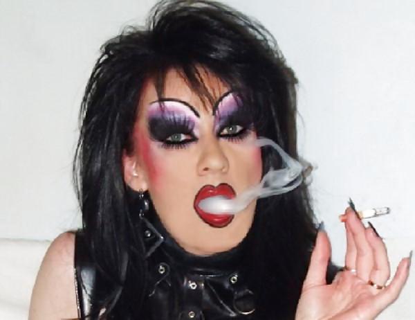 25P Smoking  glam transvestite with heavy make up