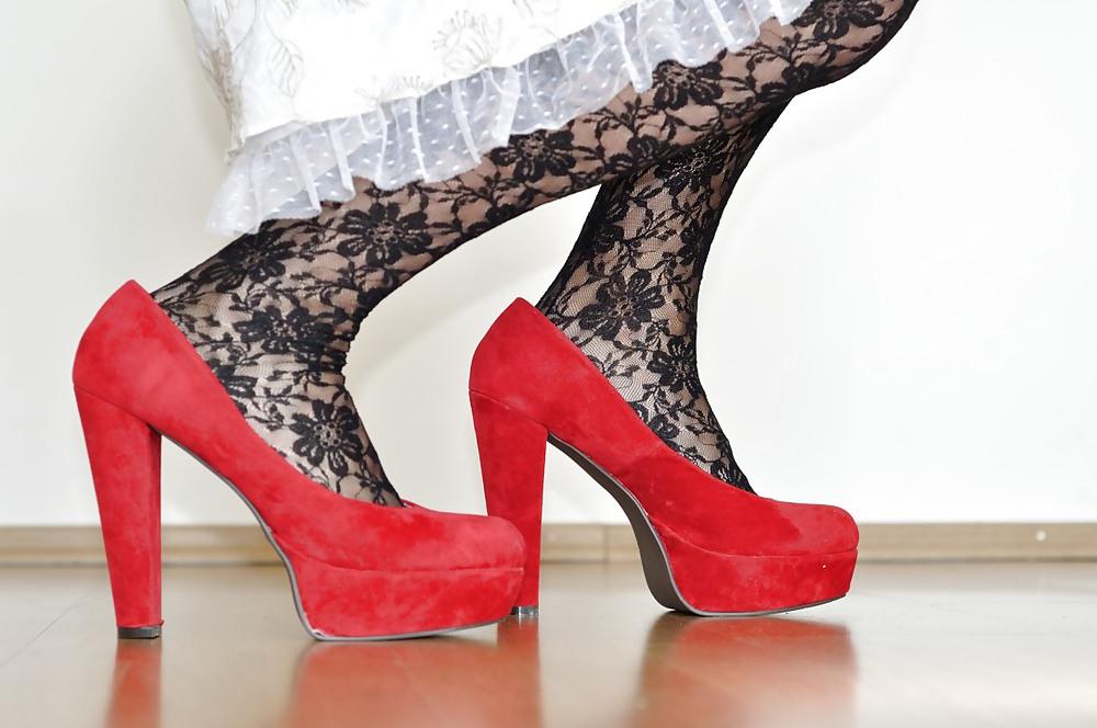 25P Crossdresser in stockings and red high heel pumps