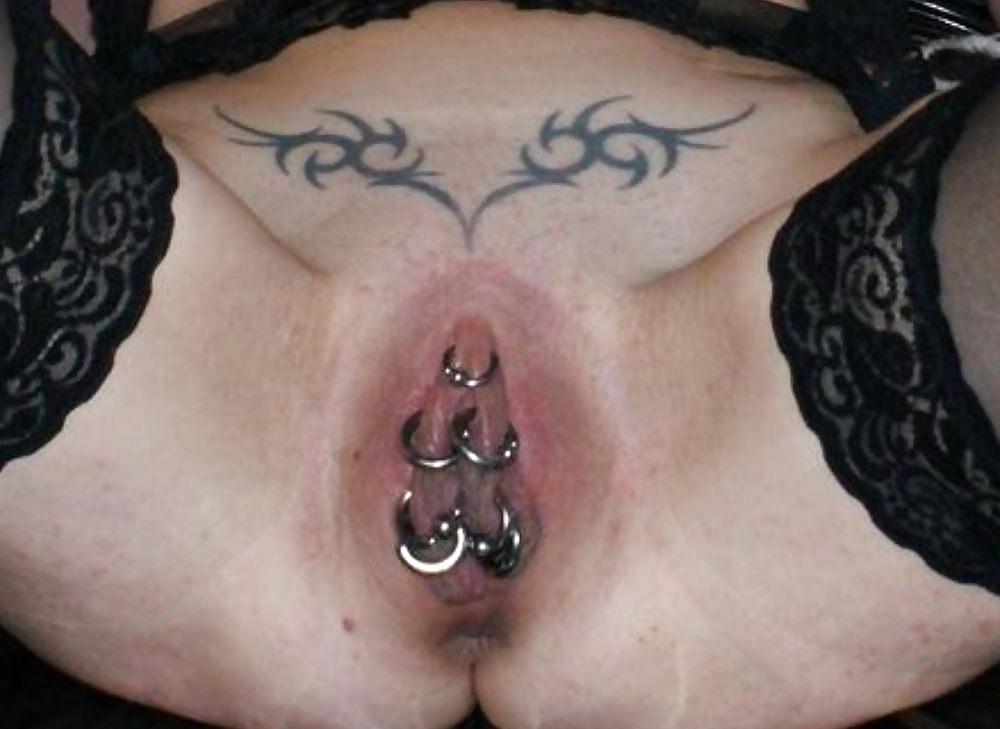 25P Weird tattooed and pierced pussies