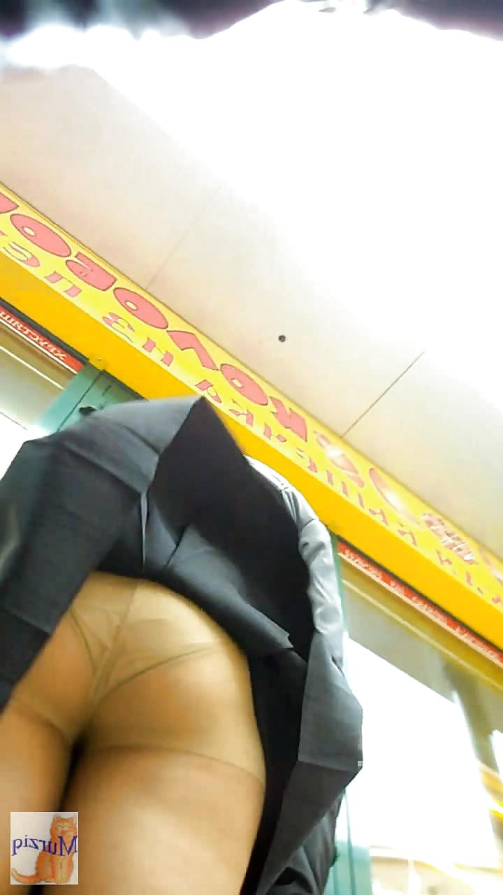 8P Pantyhose in the street-Looking up her skirt.