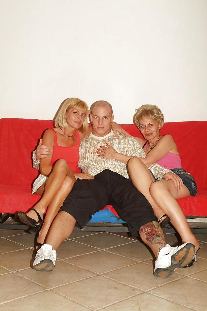12P Two older women with young men.