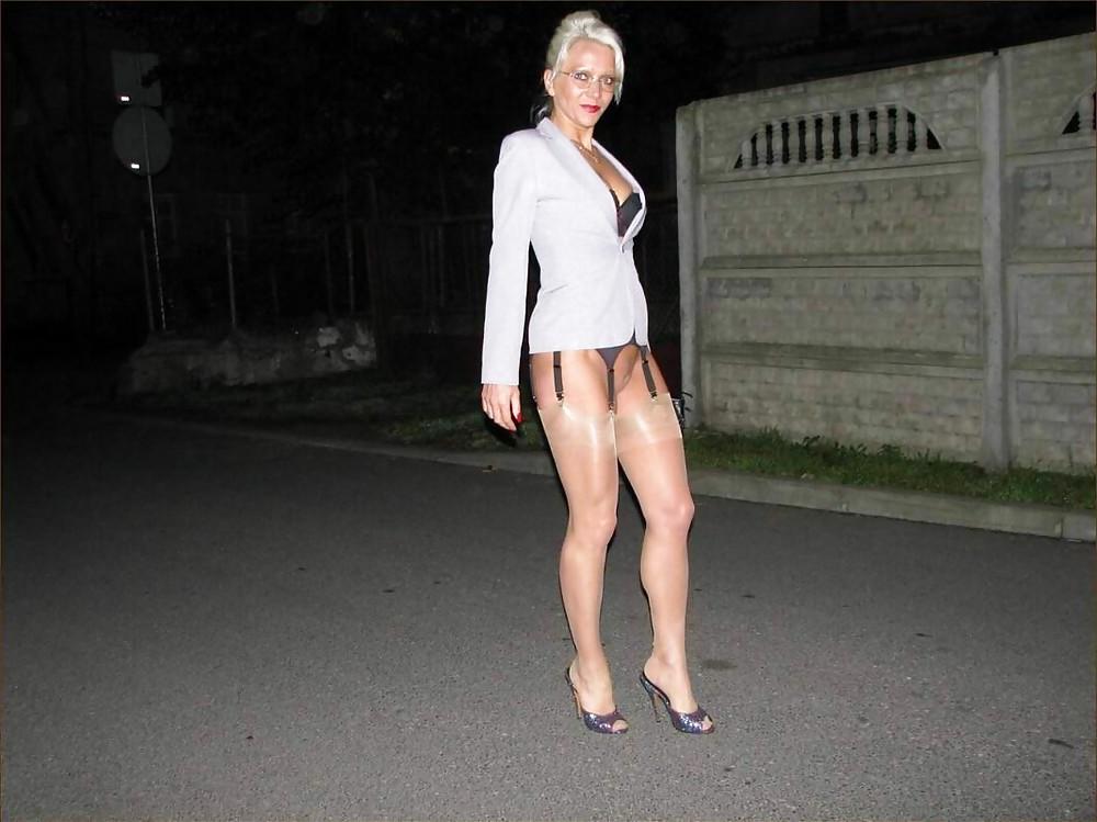 25P Blonde shows her legs in stockings 4