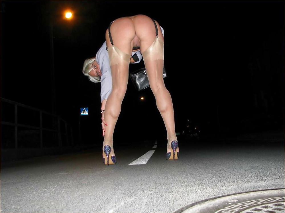 25P Blonde shows her legs in stockings 4