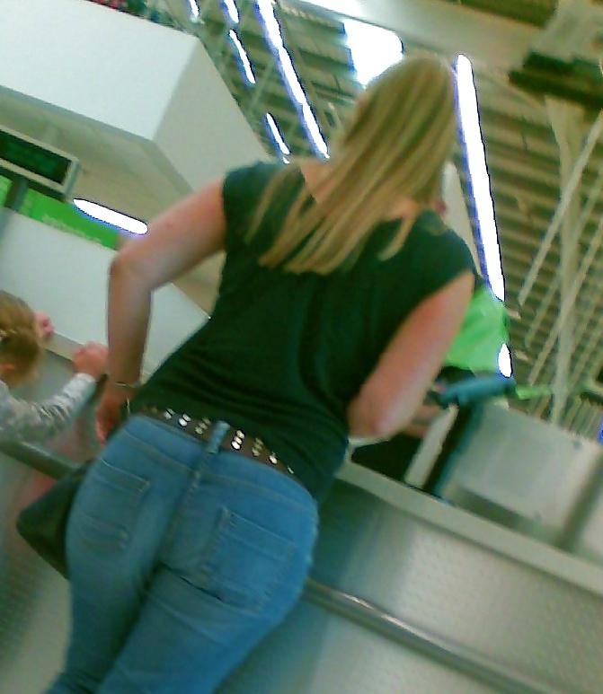 10P Sexy blonde MILF with big booty at the store