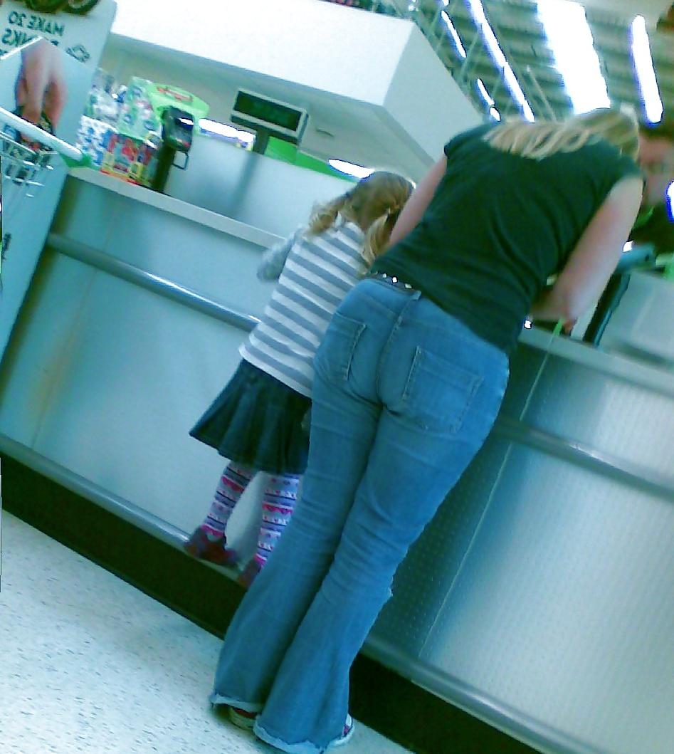 10P Sexy blonde MILF with big booty at the store