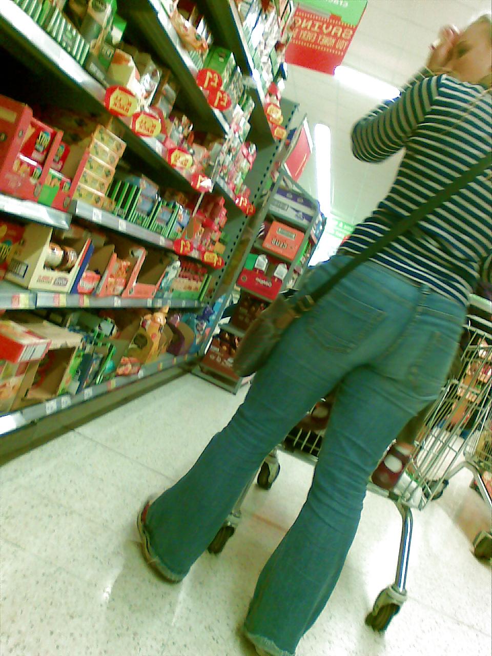 10P Sexy blonde MILF with big booty at the store