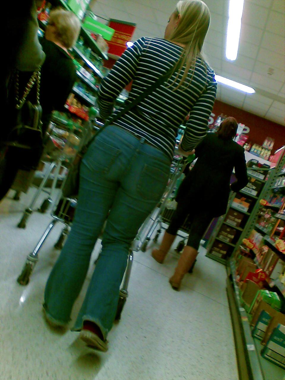 10P Sexy blonde MILF with big booty at the store