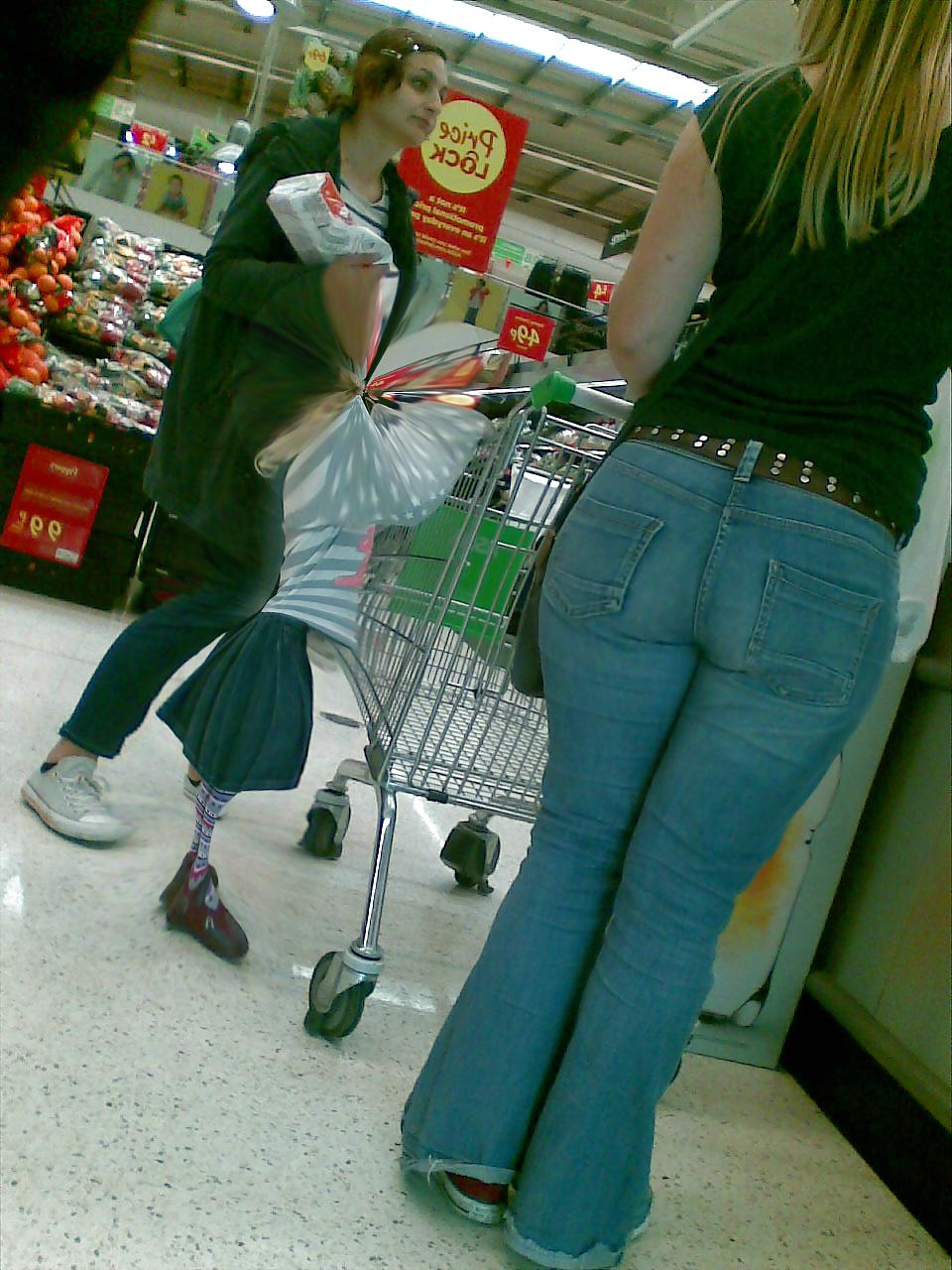 10P Sexy blonde MILF with big booty at the store