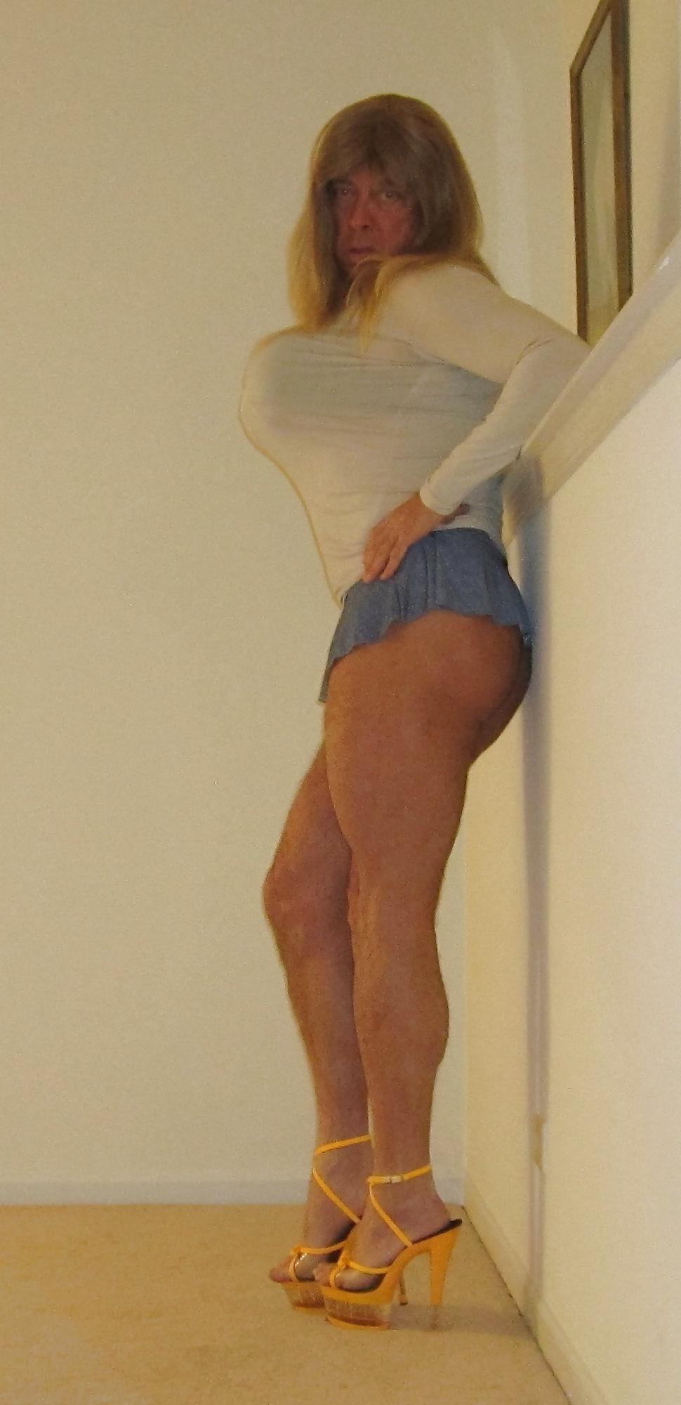 6P Tanned Blonde Crossdresser in a Cheeky Microskirt