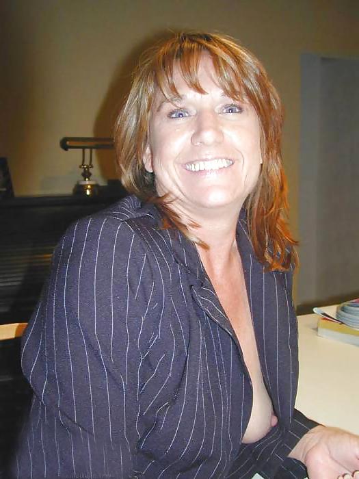 20P Businesswoman stripping after work