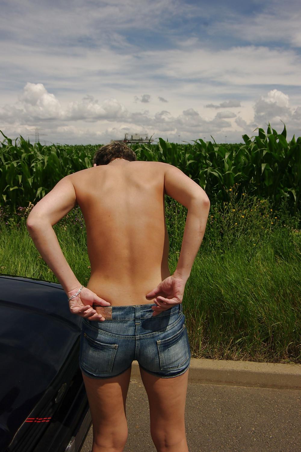 25P German topless in jeans on street