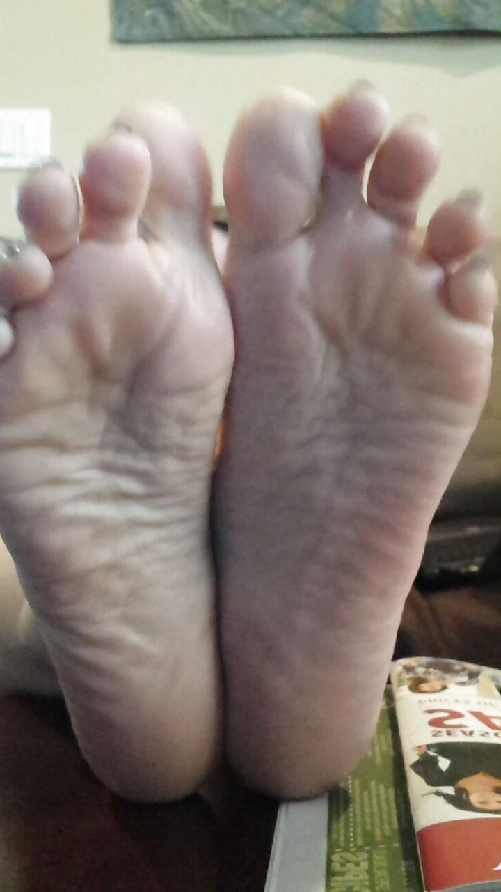 12P Sexy soles propped up on the table. 