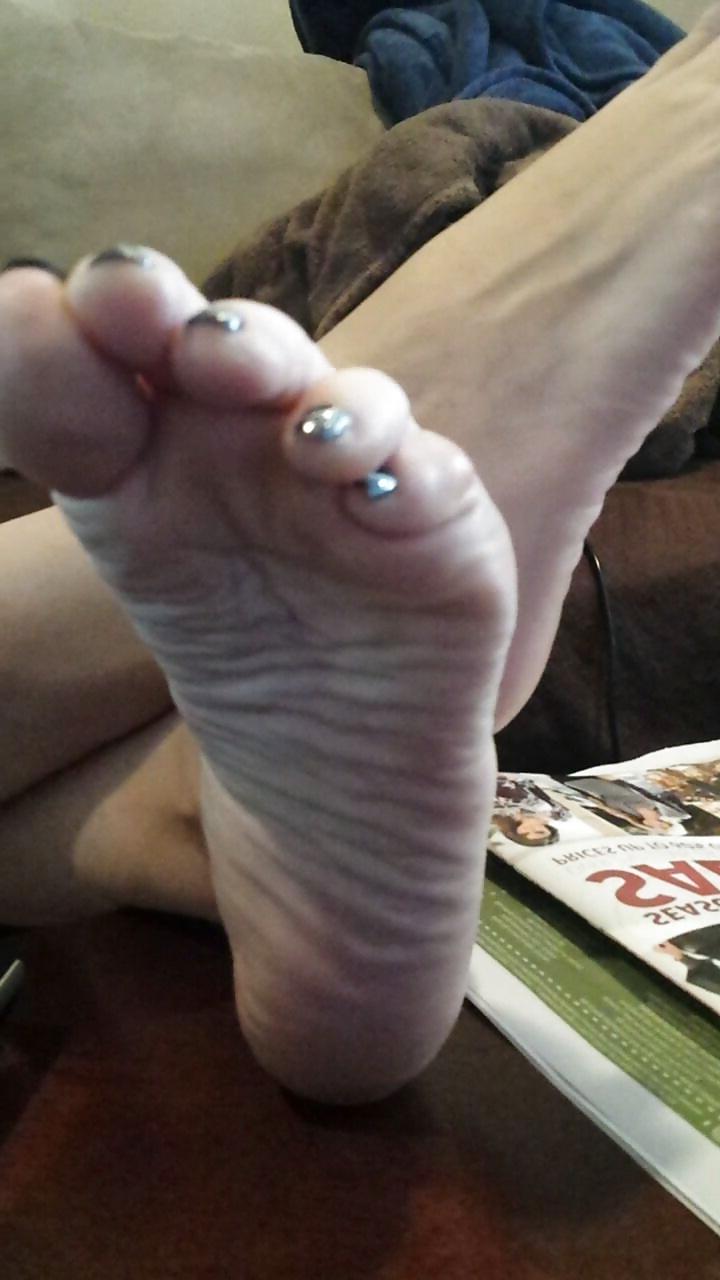 12P Sexy soles propped up on the table. 
