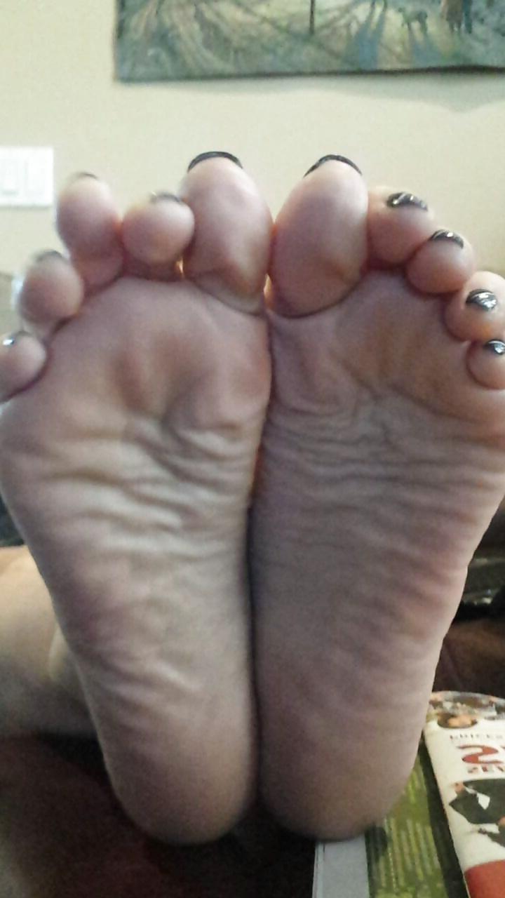 12P Sexy soles propped up on the table. 