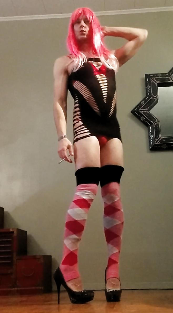 9P Kitti Cross in a black stripper dress