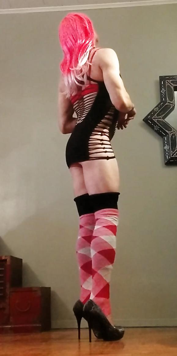 9P Kitti Cross in a black stripper dress