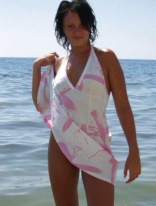 11P Brunette naked on the beach