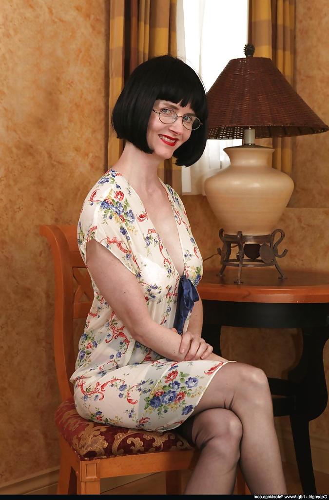 12P Naughty mature lady uncovering her tits and playing with strapon