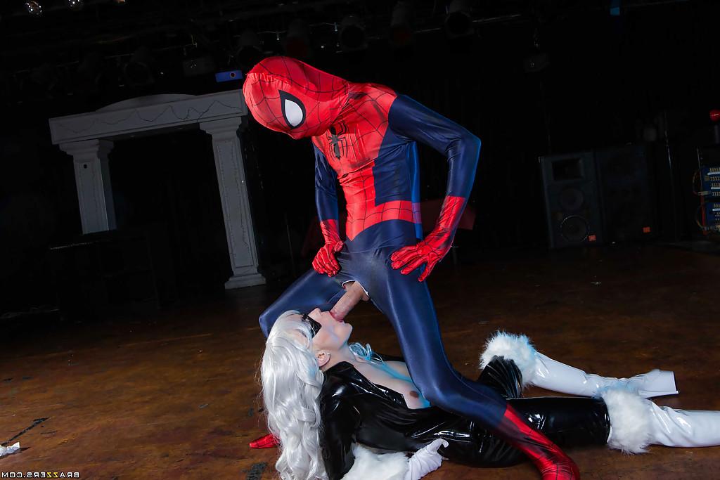 14P Blonde latex attired cosplay enthusiast with big tits giving big cock a bj