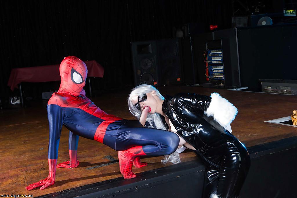 14P Blonde latex attired cosplay enthusiast with big tits giving big cock a bj