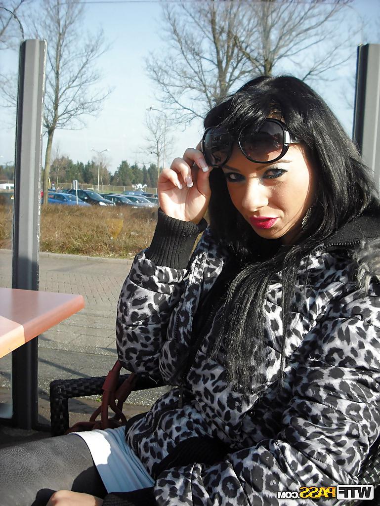 12P Lustful brunette babe in sunglasses uncovering her fuckable curves outdoor