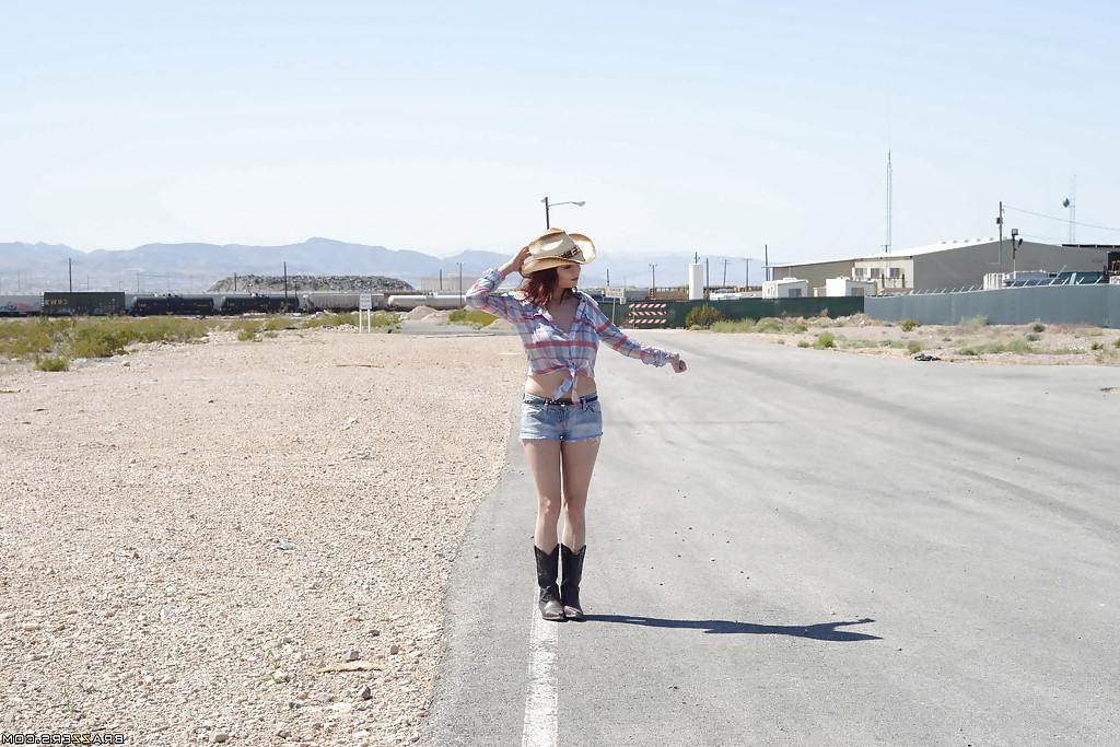 16P Huge tit redhead Ashley undressing cowboy suit and showing tits