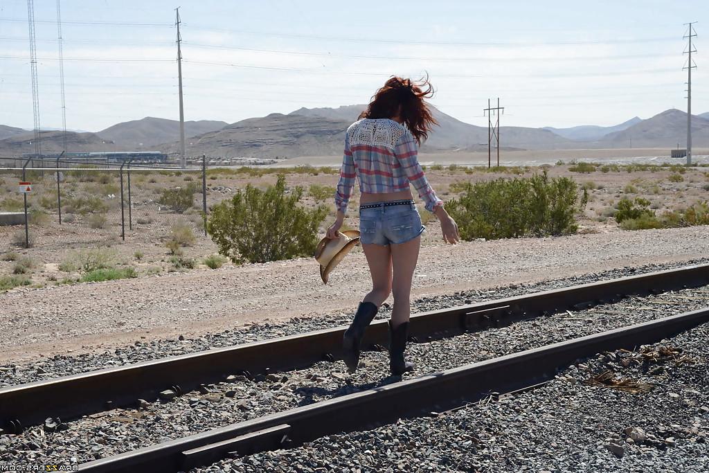 16P Huge tit redhead Ashley undressing cowboy suit and showing tits