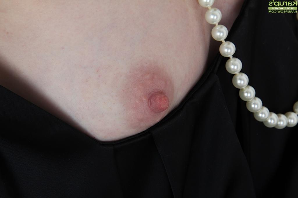 16P Tiny tits milf Ande reveals her tiny tits in a sexy black stockings