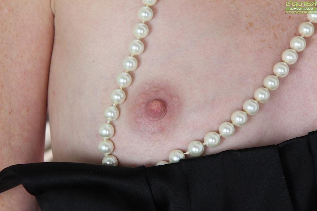 16P Tiny tits milf Ande reveals her tiny tits in a sexy black stockings