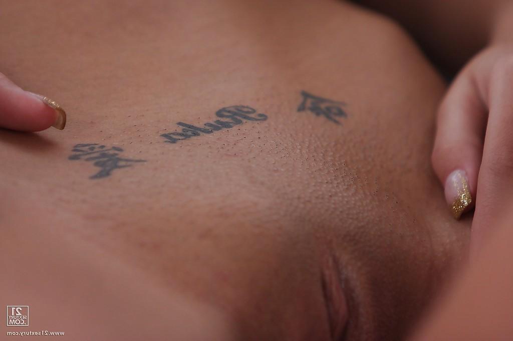 15P Playful brunette hottie revealing her ample breasts and shaved pussy