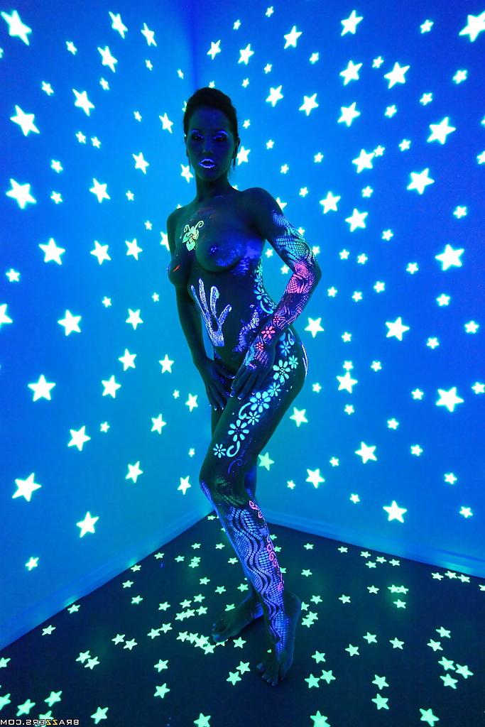 16P Angel Dark has her sexy booty and tits prettified with glowing bodyart