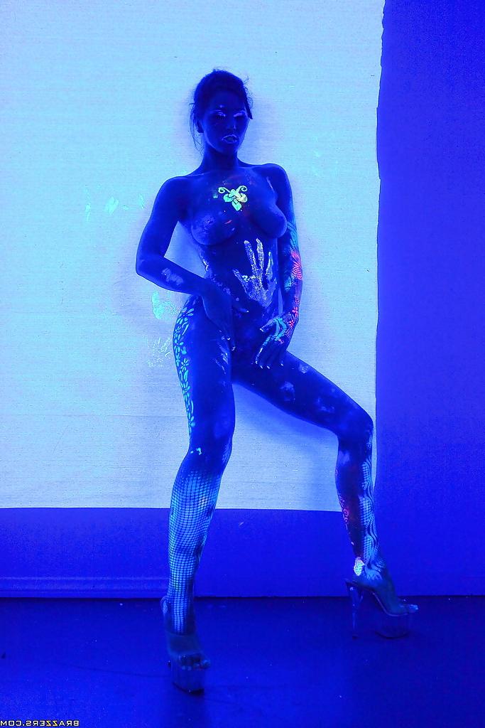 16P Angel Dark has her sexy booty and tits prettified with glowing bodyart