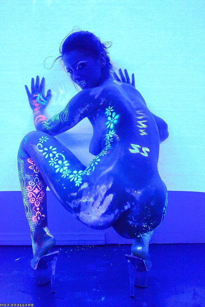 16P Angel Dark has her sexy booty and tits prettified with glowing bodyart