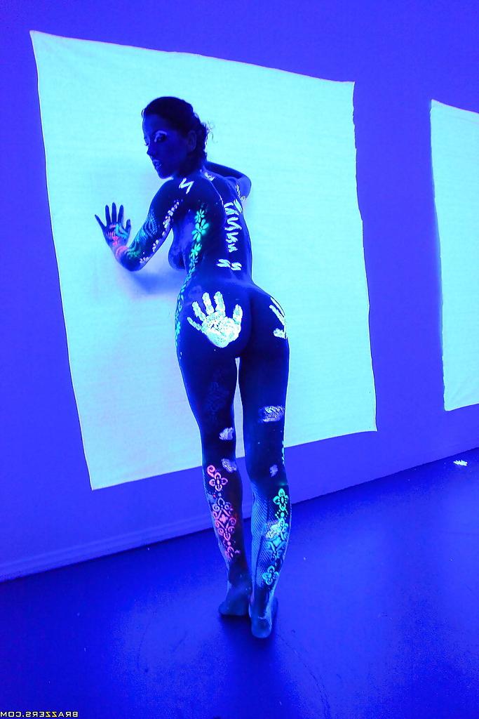 16P Angel Dark has her sexy booty and tits prettified with glowing bodyart