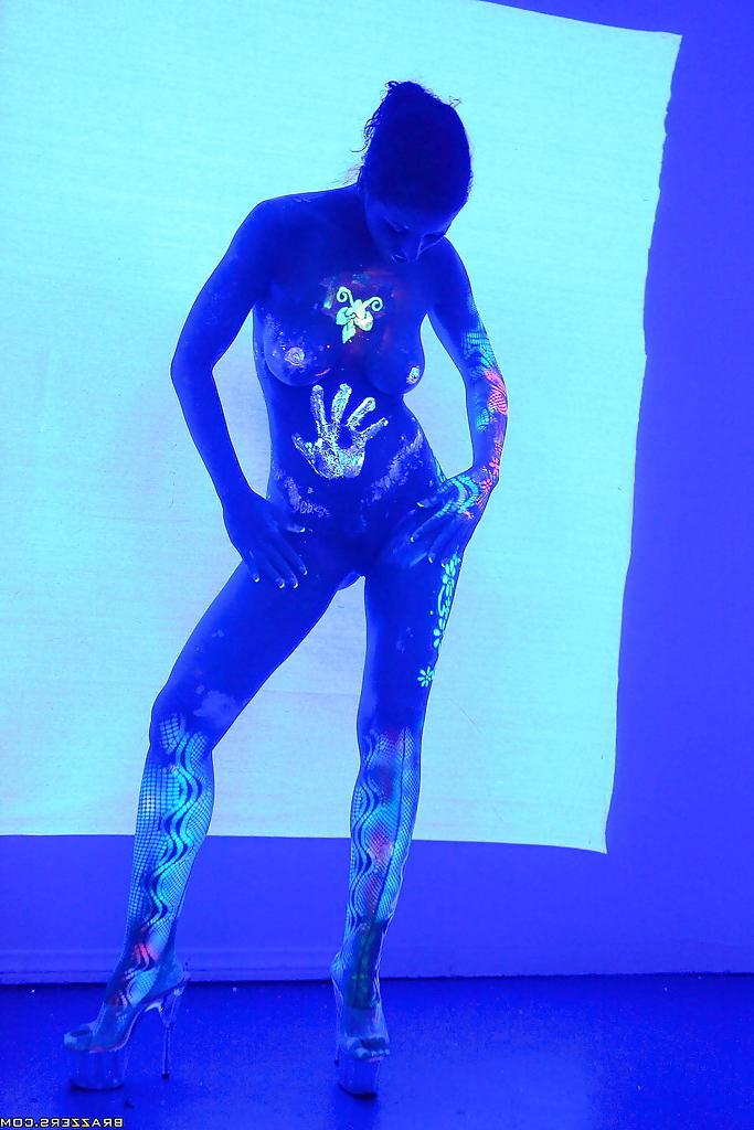 16P Angel Dark has her sexy booty and tits prettified with glowing bodyart