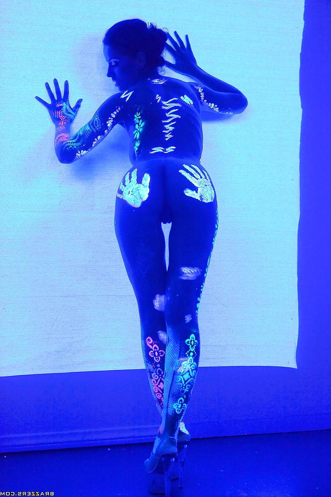 16P Angel Dark has her sexy booty and tits prettified with glowing bodyart