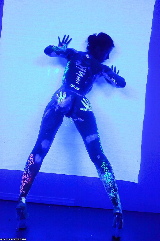 16P Angel Dark has her sexy booty and tits prettified with glowing bodyart